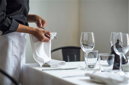 614-08578563
© Masterfile Royalty-Free
Model Release: Yes
Property Release: Yes
Waitress setting table in restaurant